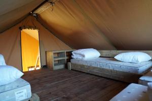 a tent with two pillows and a bed in it at F1 Weekend House Close to Spa 6 Guests Doc in Amblève