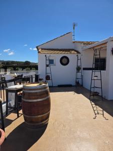 a wine barrel sitting on top of a building at Casa de las Murallas, Bed&Breakfast in Yecla +37 photos