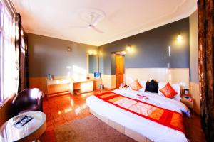 En eller flere senge i et værelse på Hotel Ekant