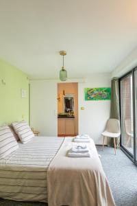 a bedroom with a large bed in a room at La Colombe bleue & SPA in Binic