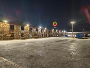 a mcdonalds parking lot in front of a building at night at Plaza Hotel By OYO Calumet Park Alsip I 57 in Calumet Park