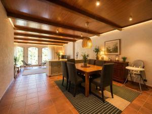 a dining room with a table and chairs at Luxury Rocamar – Primera Línea y Terraza in Tossa de Mar