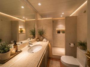 a bathroom with a sink and a toilet at Luxury Rocamar – Primera Línea y Terraza in Tossa de Mar +42 photos