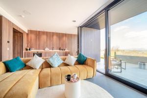 a living room with a couch and a large window at 1 Bed in Oban oc-t41733 in Acharra