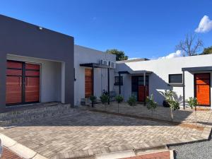 a modern house with a driveway at 47 Northward BnB in Newcastle