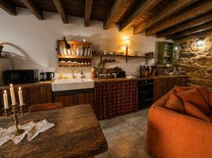 a kitchen with a sink and a counter top at Casa do Tio Zé Montesinho in Montezinho +26 photos