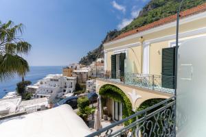 a balcony of a building with a view of the ocean at Casa Consilla in Positano