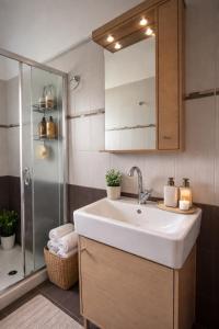 a bathroom with a sink and a shower at Artemisa House in Agia Roumeli