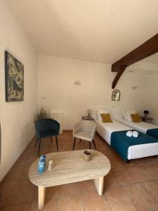 a hotel room with a bed and a table at Golf Hotel de la Carte in Chouzy-sur-Cisse +54 photos
