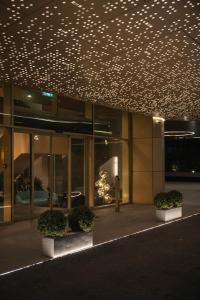 a building with a bunch of lights on the ceiling at Designer Suite • Pool & Sauna • Pipera Metro in Bucharest