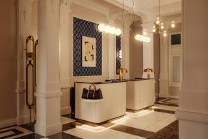 a lobby with a counter with a purse on it at The Manor Amsterdam in Amsterdam