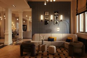 a living room with a couch and two chairs at The Manor Amsterdam in Amsterdam