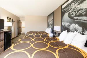 a hotel room with a large bed in it at Mid Rest Inn Lexington NE I-80 in Lexington