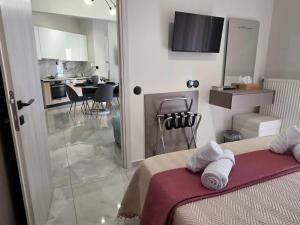 a bedroom with a bed with towels on it at Dream Home Veria in Veria