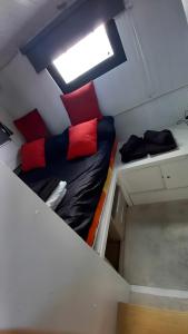 a bunk bed in a room with a skylight at The Blue Boat in Valence