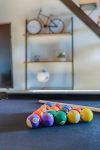 a group of eggs on the floor in a room at L'escarpin - Billiards - Historic in Romans-sur-Isère