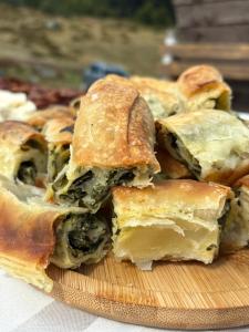 a pile of puff pastry on a cutting board at Eko Katun Kolijevka in Berane