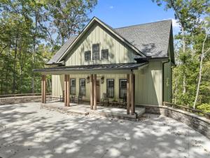 a house with a large patio in front at Bear Paws in Townsend