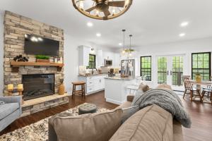 a living room with a couch and a fireplace at Bear Paws in Townsend