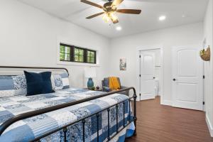 a bedroom with a bed and a ceiling fan at Bear Paws in Townsend