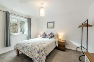 a bedroom with a bed and a window at 2 Bed in Berrynarbor oc-l34468 in Berrynarbor