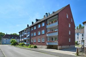 a red brick building on the side of a street at SANO - Hagen - Hegel in Hagen