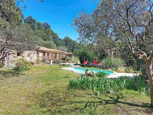 a house with a pool in a yard at Holiday Home Chez Canard by Interhome in Ampus +56 photos