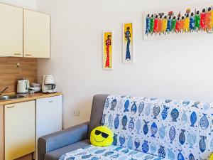 a living room with a couch and a kitchen at Apartment Euroville-1 by Interhome in Germignaga +17 photos