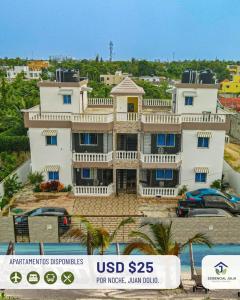 a large white house on top of a street at Residential Jula in Los Prados