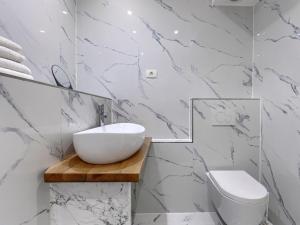 a bathroom with a sink and a toilet at Apartment File-6 by Interhome in Zambratija