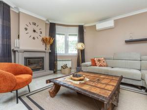 a living room with a couch and a table at Villa Mys by Interhome in Miami Platja +28 photos