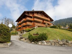 a large building on top of a hill at Apartment Pré Vert 3 by Interhome in Villars-sur-Ollon