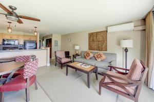 a living room with a couch and a table at Ocean View Condo Pono Kai Resort PF-G102 in Kapaa