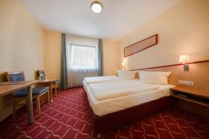 Postel nebo postele na pokoji v ubytování Montana Hotel