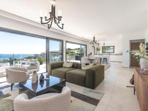 a living room with a couch and chairs at Villa Casa Minà by Interhome in Sari Solenzara