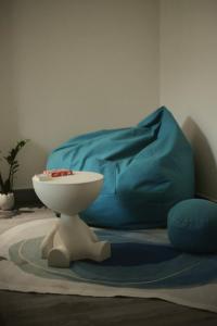 a toilet sitting on a rug in a room with a bed at BeHomestay in Hai Phong +36 photos