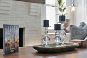 a table with two wine glasses and a book at Rivercrest Bungalow Retreat in Tampa +32 photos