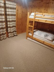a room with two bunk beds in it at Le balcon de Mâche in Hérémence
