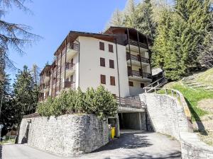 a building on the side of a mountain at Apartment La Marmotta by Interhome in Madesimo