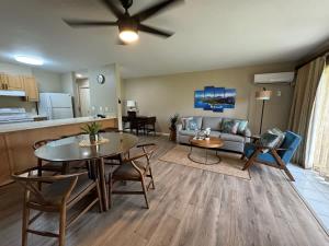 a living room with a couch and a table at 2 Bedroom OceanView Condo Pono Kai Resort E103 in Kapaa