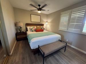a bedroom with a bed and a ceiling fan at 2 Bedroom OceanView Condo Pono Kai Resort E103 in Kapaa +37 photos