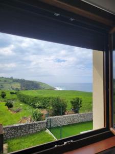 a view of the ocean from a window at CASA FREDO in Cóbreces