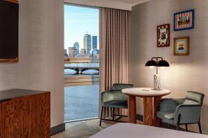 a hotel room with a view of a city at The Royal Sonesta Boston in Cambridge +88 photos