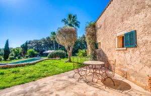 a patio with a table and chairs next to a building at Esteva in Sant Llorenç des Cardassar +37 photos