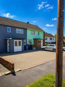 a house with a car parked in front of it at Nayla House Cozy 4BR with Garden & Parking in Moffat