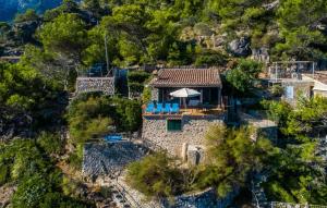 an aerial view of a house on a mountain at Amaret in Deia