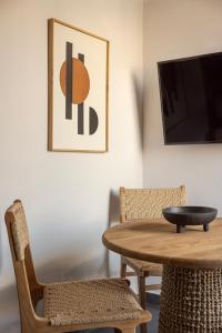 a dining room with a table and two chairs at Annas's Main Street Apartment in Skala