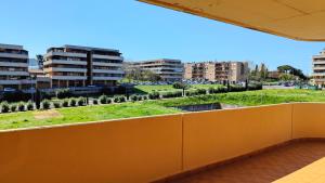 a view from the balcony of a building at NUOVO Alloggio Giardino di Rosy tra Roma EUR e il Mare di Ostia in Vitinia