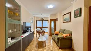 a living room with a couch and a table at Jaca Centrum in Jaca