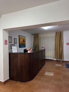 an office with a reception desk in a room at Pensiunea Valea Galbenei in Arieşeni
